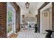 Bright sun room with brick walls, tile floors, and comfortable seating area at 16 Walker Ne Ter, Atlanta, GA 30309
