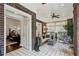 Bright sun room with brick walls, tile floors, and view to the living and dining area at 16 Walker Ne Ter, Atlanta, GA 30309