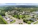 This aerial image showcases a community layout with parks, commercial areas, diverse housing, and convenient road networks at 397 Cypher Dr, Suwanee, GA 30024
