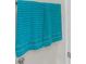 The bathroom features neatly hung, soft, teal-colored towels on the towel rack at 397 Cypher Dr, Suwanee, GA 30024