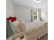 This cozy bedroom is brightly lit from the sunlight coming through the window at 397 Cypher Dr, Suwanee, GA 30024