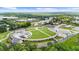 A captivating aerial image showcasing a central park area in the community surrounded by lush trees at 397 Cypher Dr, Suwanee, GA 30024