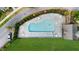Aerial view of the community pool with lounge chairs, tables and umbrellas, providing a relaxing and enjoyable space at 397 Cypher Dr, Suwanee, GA 30024