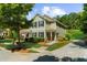 Charming two-story home with a well-manicured front yard and a driveway at 397 Cypher Dr, Suwanee, GA 30024