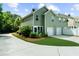 A lovely townhome features a well-manicured lawn and a two-car garage at 397 Cypher Dr, Suwanee, GA 30024