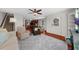 Inviting living room with hardwood floors, ceiling fan, and open access to the kitchen at 397 Cypher Dr, Suwanee, GA 30024