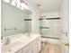 Bathroom features double sink vanity and shower over tub at 630 Beckenham Walk Dr, Dacula, GA 30019