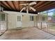The back porch features a ceiling fan, wooden floors, and a shingled wall at 6516 Maddox Rd, Morrow, GA 30260