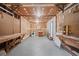 The unfinished basement features concrete floors and lots of storage space at 6516 Maddox Rd, Morrow, GA 30260