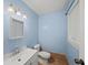This bright bathroom includes a large vanity, white toilet, and a window for natural light at 6516 Maddox Rd, Morrow, GA 30260