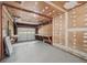 The unfinished garage features concrete floors and lots of storage space at 6516 Maddox Rd, Morrow, GA 30260