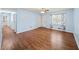 This living room offers wood-look flooring, a ceiling fan, light-filled room at 6516 Maddox Rd, Morrow, GA 30260
