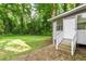 Back entrance to the house with wood stairs leading to a patio and backyard at 752 Jefferson Sw Ave, Atlanta, GA 30315