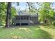 View of the house from the spacious backyard with mature trees at 752 Jefferson Sw Ave, Atlanta, GA 30315