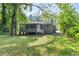 View of the house from the spacious backyard with mature trees at 752 Jefferson Sw Ave, Atlanta, GA 30315