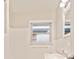 This bathroom features white tile, a window, and a single sink at 752 Jefferson Sw Ave, Atlanta, GA 30315