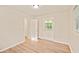 Bright bedroom with neutral walls, light hard wood flooring, with ceiling fan at 752 Jefferson Sw Ave, Atlanta, GA 30315