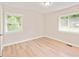 This bedroom features light walls, two windows, and wood floors at 752 Jefferson Sw Ave, Atlanta, GA 30315