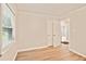 This bedroom has light-colored walls and wood-look floors at 752 Jefferson Sw Ave, Atlanta, GA 30315