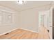 The bedroom has light walls, trim, and hardwood floors at 752 Jefferson Sw Ave, Atlanta, GA 30315