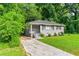 Inviting home boasts a concrete driveway, well-maintained lawn, and fresh landscaping at 752 Jefferson Sw Ave, Atlanta, GA 30315