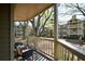 View from private balcony overlooking courtyard with green space and mature trees at 1315 Mcgill Park Ne Ave, Atlanta, GA 30312