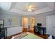 This bedroom has wood floors, neutral walls, great natural light and is set up as an office space at 1315 Mcgill Park Ne Ave, Atlanta, GA 30312