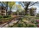 Beautifully landscaped exterior with mature trees, well-maintained grounds, and charming architectural details at 1315 Mcgill Park Ne Ave, Atlanta, GA 30312