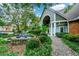 Charming community entrance featuring a fountain, lush landscaping, and welcoming architecture at 1315 Mcgill Park Ne Ave, Atlanta, GA 30312