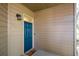 Charming front door with sidelight, exterior light fixture, and neutral siding at 1315 Mcgill Park Ne Ave, Atlanta, GA 30312