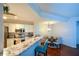 Modern kitchen with white cabinets, stainless steel appliances, granite countertop and a breakfast bar at 1315 Mcgill Park Ne Ave, Atlanta, GA 30312