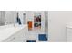 Bright bathroom featuring double sinks, white marble counters, and walk-in closet at 1534 Bedstone Dr, Canton, GA 30114