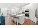 Bright kitchen features a central island, stainless appliances, and white cabinetry at 1534 Bedstone Dr, Canton, GA 30114