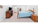 Cozy main bedroom featuring a wooden four poster bed and fireplace at 1534 Bedstone Dr, Canton, GA 30114