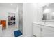 Bathroom with marble floors and countertops plus a view into the walk-in closet and shower at 1534 Bedstone Dr, Canton, GA 30114
