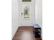 Cozy entryway featuring hardwood floors, a bench, and a front door with glass paneling at 1534 Bedstone Dr, Canton, GA 30114