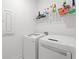 Efficient laundry area with modern appliances and shelving for organized storage solutions at 1534 Bedstone Dr, Canton, GA 30114