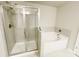 Bathroom with a combined shower and soaking tub with tile surround at 2314 Shetley Creek Dr, Norcross, GA 30071