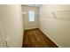 Walk-in closet with carpet floors, a window, and wire shelving at 2314 Shetley Creek Dr, Norcross, GA 30071