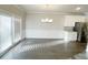 Dining area with modern chandelier, wainscoting, and access to the backyard at 2314 Shetley Creek Dr, Norcross, GA 30071