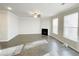 Spacious living room with fireplace, hardwood floors, and natural light at 2314 Shetley Creek Dr, Norcross, GA 30071
