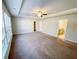 Large main bedroom featuring carpet flooring, a ceiling fan, and ensuite bathroom and walk-in closet at 2314 Shetley Creek Dr, Norcross, GA 30071