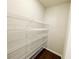 Pantry featuring wire shelving and dark wood flooring at 2314 Shetley Creek Dr, Norcross, GA 30071