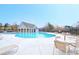 Beautiful community pool with a clubhouse, lounge chairs and seating at 2314 Shetley Creek Dr, Norcross, GA 30071