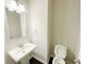 Powder room with pedestal sink and modern fixtures at 2314 Shetley Creek Dr, Norcross, GA 30071