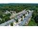 An aerial view shows this neighborhood's well-maintained townhomes, lush trees, and proximity to green spaces at 2968 Oshields Sw Ct # 4, Marietta, GA 30060