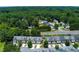 An aerial view of townhomes shows uniform architecture, well-kept landscaping, and convenient street layout at 2968 Oshields Sw Ct # 4, Marietta, GA 30060