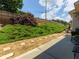 A secluded backyard features a stone paver pathway and established landscaping, creating a serene outdoor space at 2968 Oshields Sw Ct # 4, Marietta, GA 30060