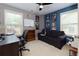 Cozy bedroom featuring natural light, comfortable seating, and versatile workspace, perfect for relaxation and productivity at 2968 Oshields Sw Ct # 4, Marietta, GA 30060