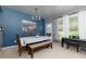 Stylish dining room with large windows, a piano, and a modern chandelier, perfect for entertaining at 2968 Oshields Sw Ct # 4, Marietta, GA 30060